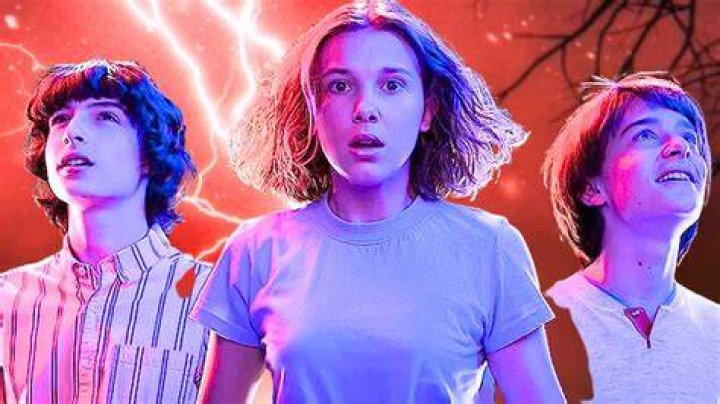 stranger things l to r finn wolfhard as mike wheeler, millie bobby brown as eleven and noah schnapp as will byers in stranger things cr courtesy of netflix &copy; 2022